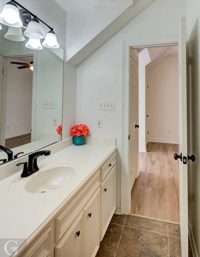 bathroom featuring ceiling fan, vanity, and hardwood / wood-style flooring