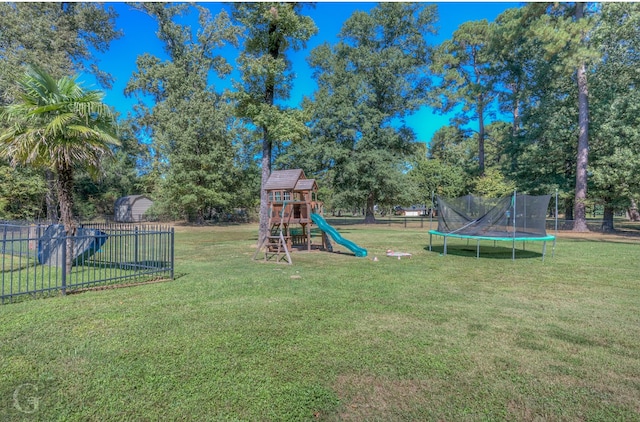 view of yard with a playground and a trampoline