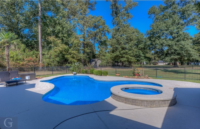 view of pool featuring a patio and an in ground hot tub