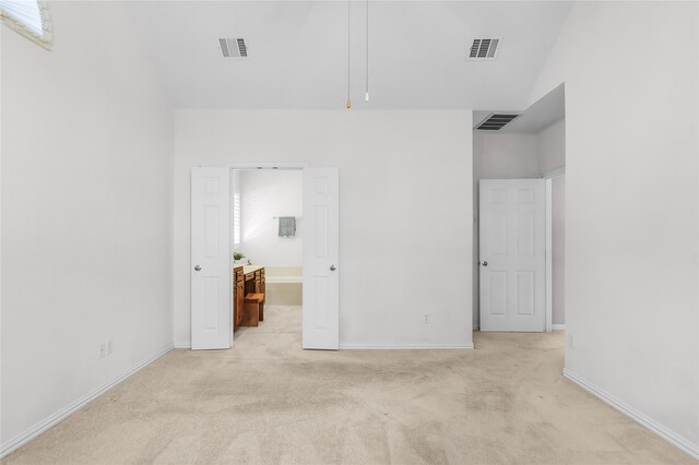 unfurnished bedroom with light carpet