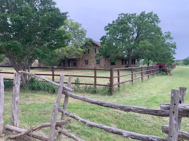 view of yard with a rural view