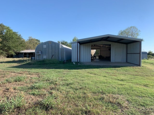 view of outbuilding with a yard