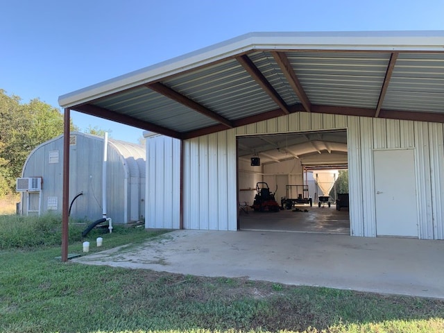 exterior space with a lawn and a wall mounted air conditioner