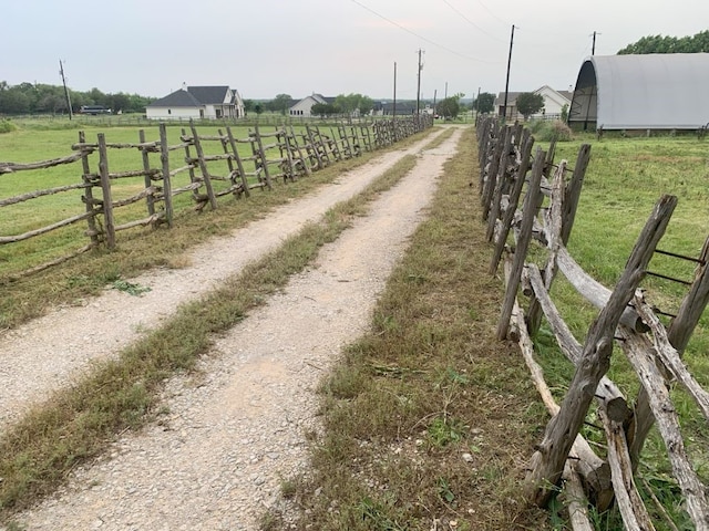 view of street featuring a rural view