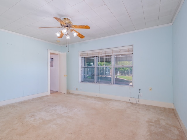 spare room with light carpet, crown molding, and ceiling fan