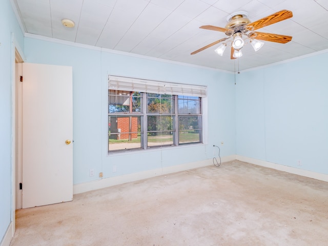 unfurnished room with ornamental molding, ceiling fan, and light colored carpet