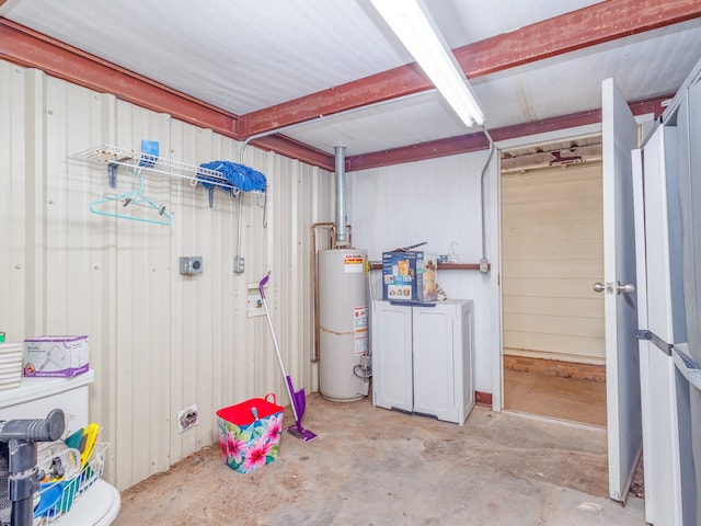 basement featuring gas water heater and wood walls