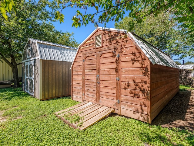 view of outdoor structure featuring a yard