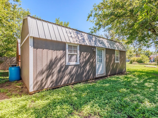 view of outbuilding featuring a yard