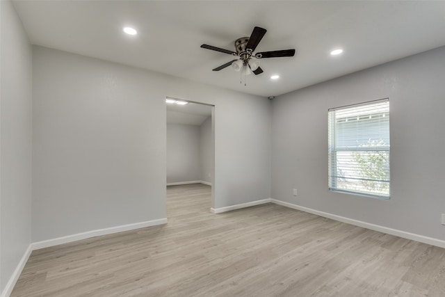 empty room with light hardwood / wood-style floors and ceiling fan