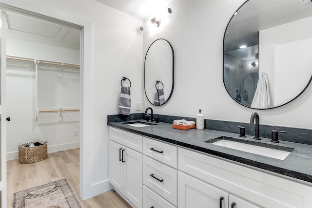 bathroom featuring hardwood / wood-style floors and vanity