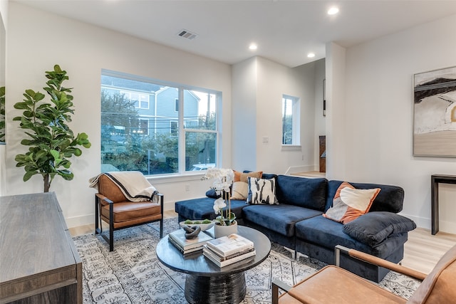 living room with light hardwood / wood-style floors