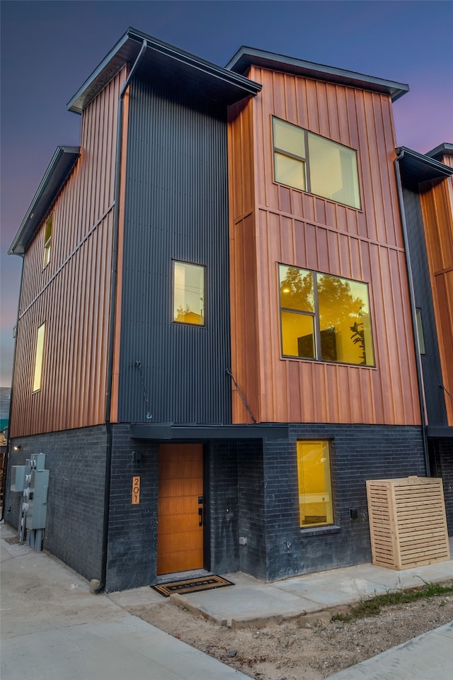 view of outdoor building at dusk