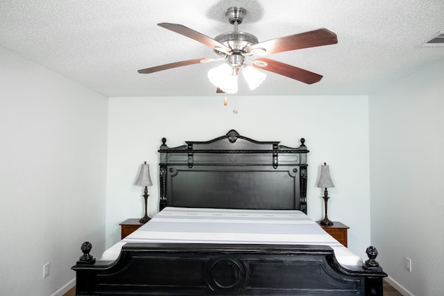 3604 Fort Hunt Dr, Arlington, TX 76016 - bedroom featuring visible vents, baseboards, a textured ceiling, and a ceiling fan