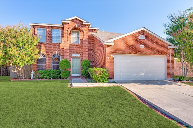 view of front of property with a garage and a front yard