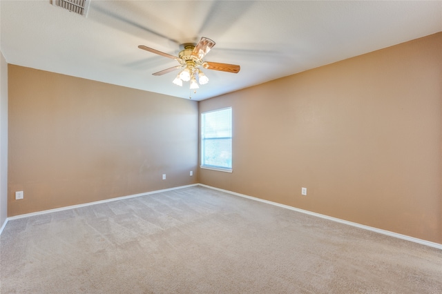 unfurnished room with light carpet and ceiling fan