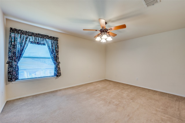 carpeted empty room with ceiling fan