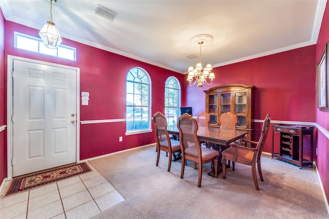 carpeted dining area with crown molding and a chandelier