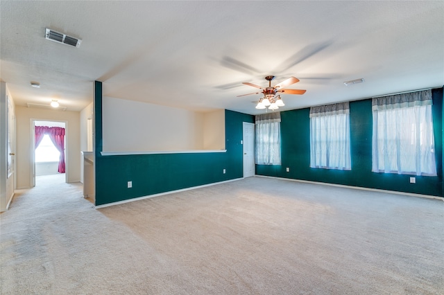 carpeted empty room with ceiling fan