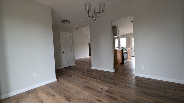 interior space with dark hardwood / wood-style floors and an inviting chandelier