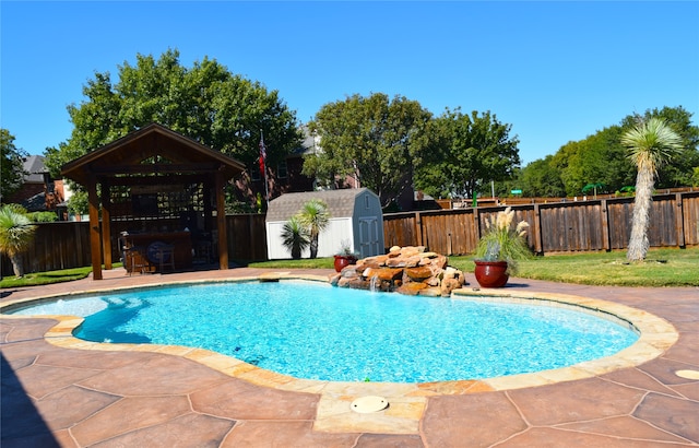 view of swimming pool with a gazebo, a storage shed, and a patio