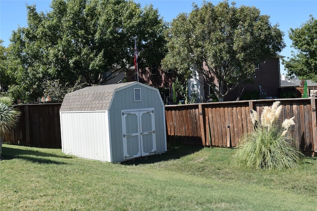 view of outbuilding with a lawn