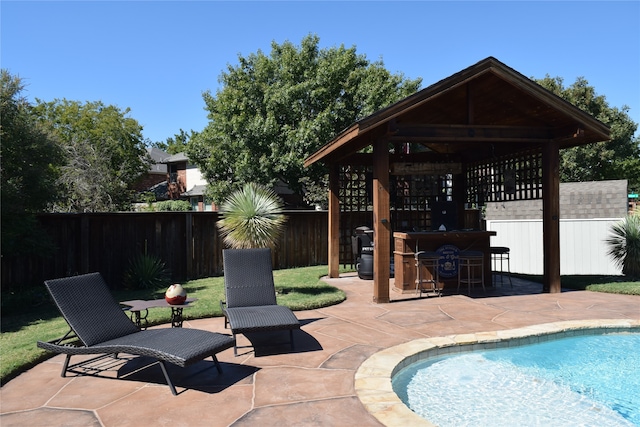 view of swimming pool featuring a gazebo and a patio area