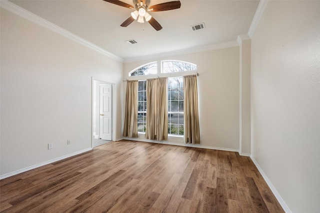 spare room with crown molding, hardwood / wood-style floors, and ceiling fan