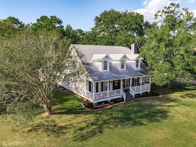 9321 Mccain Rd, Shreveport, LA 71107 - new england style home with metal roof, a front lawn, covered porch, and a chimney