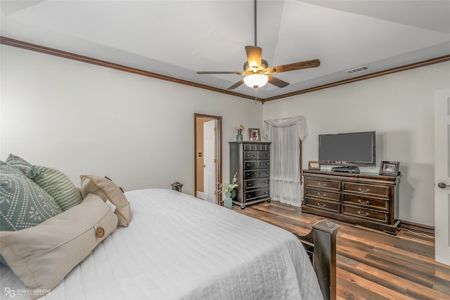 bedroom with ceiling fan, crown molding, and dark hardwood / wood-style flooring