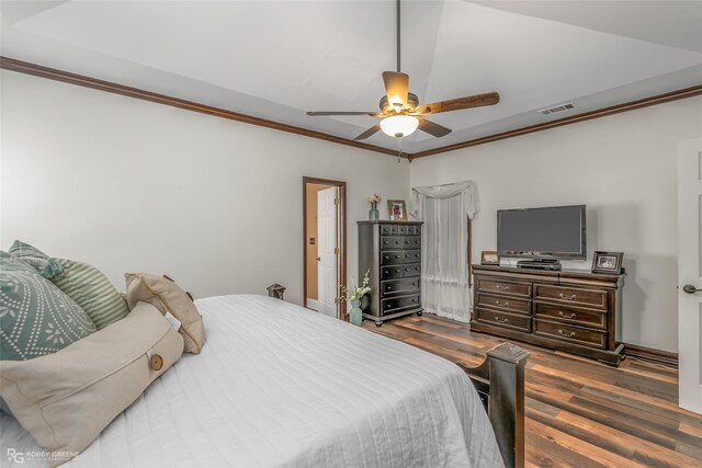 9321 Mccain Rd, Shreveport, LA 71107 - bedroom featuring ornamental molding, a ceiling fan, visible vents, and dark wood-style flooring