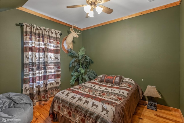 9321 Mccain Rd, Shreveport, LA 71107 - bedroom with ceiling fan and wood finished floors