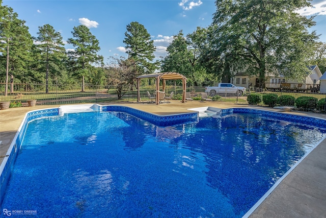 view of swimming pool with a patio area