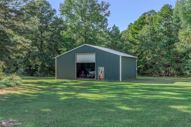 view of outbuilding featuring a lawn