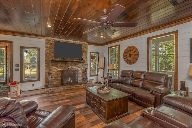 living room featuring wooden ceiling, dark wood-type flooring, ceiling fan, and plenty of natural light