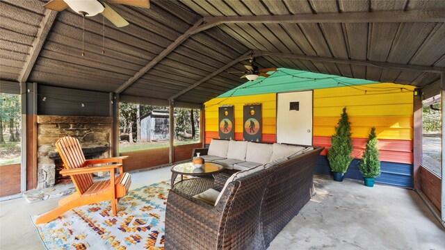 sunroom / solarium with vaulted ceiling and ceiling fan