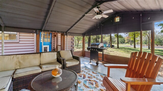 sunroom featuring wood ceiling, vaulted ceiling, and ceiling fan