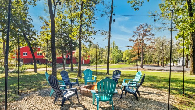 view of yard with an outdoor fire pit