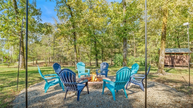 view of yard with an outdoor fire pit