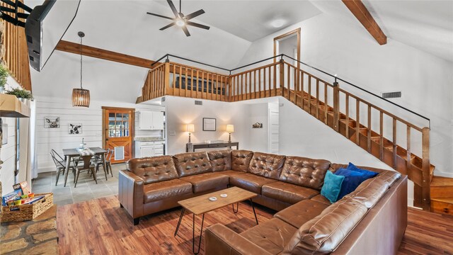 living room featuring high vaulted ceiling, ceiling fan, and hardwood / wood-style flooring