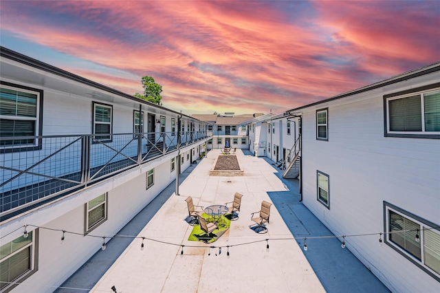 view of home's community with a patio area