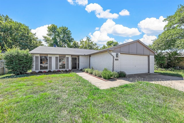 single story home featuring a front lawn and a garage