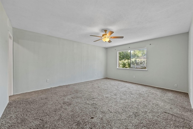 unfurnished room featuring ceiling fan, carpet floors, and a textured ceiling