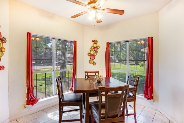 dining space with ceiling fan, plenty of natural light, and light tile patterned flooring