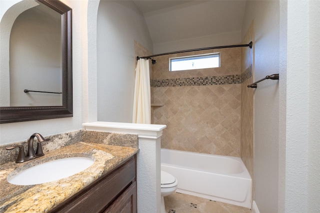 full bathroom with lofted ceiling, vanity, toilet, and shower / bath combination with curtain