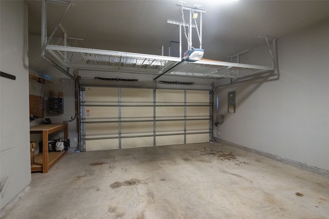 garage featuring a garage door opener and electric panel