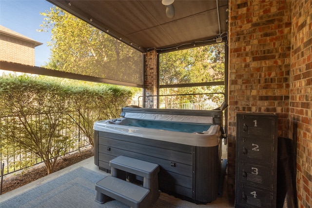 view of patio with a hot tub