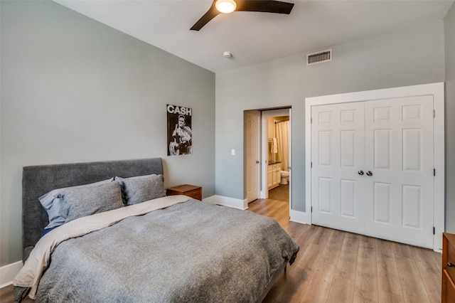 bedroom featuring ceiling fan, light hardwood / wood-style floors, and a closet