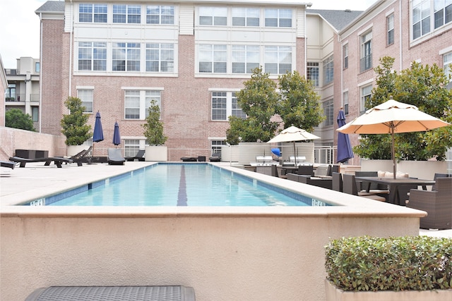 view of swimming pool featuring a patio area