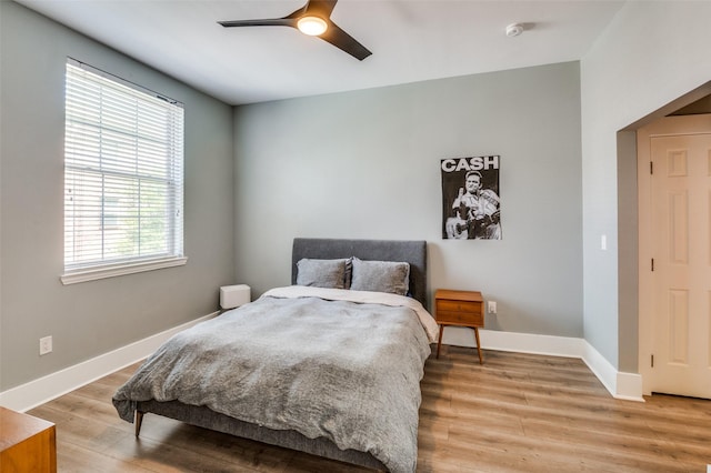 bedroom featuring ceiling fan and light hardwood / wood-style floors